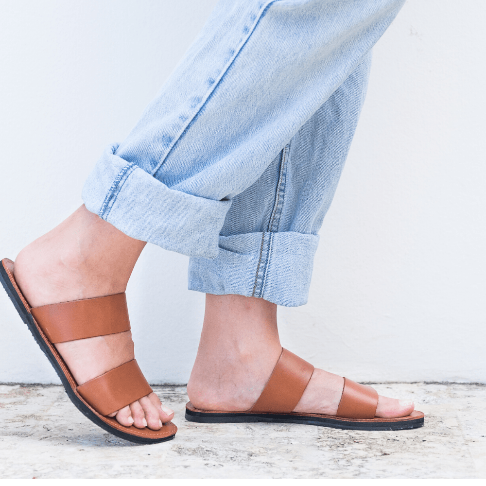 Front side view of the Ophelia Leather slide sandals sustainably made by Brave Soles in caramel color