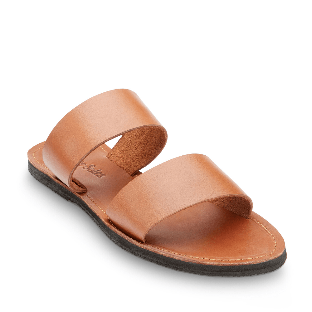Front side view of the Ophelia Leather slide sandals sustainably made by Brave Soles in caramel color