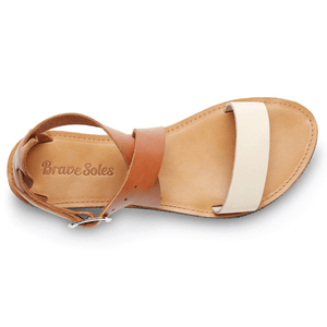 Top view of Brave Soles Sustainably made Jasmine leather sandals with recycled tire soles in ivory and caramel color