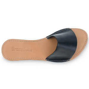 Top view of The Linda Women's Leather Slide Sandal in black and natural color, sustainably made by Brave Soles. 