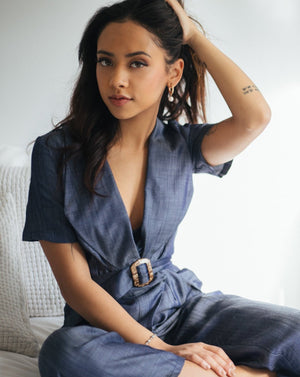 Blue chambray Tencel denim pantsuit with coconut shell buckle belt.